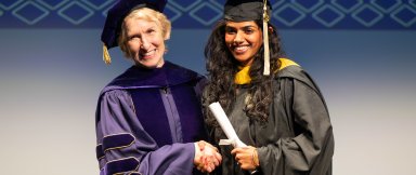 Dean Lozier congratulates a newly minted College of Sciences alum.
